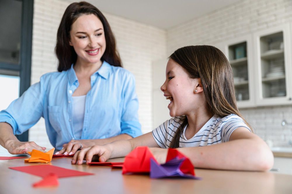 Therapist and child laughing during a session